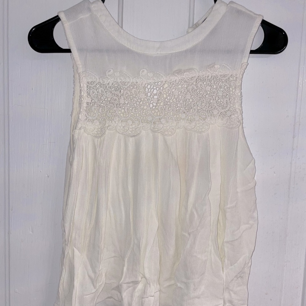 Sleeveless white lace top